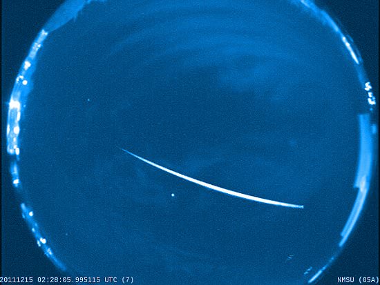 A Geminid fireball brighter than Venus streaks across the sky above New Mexico on Dec. 14, 2011. It was captured by an all-sky camera. Before disintegrating in the atmosphere the meteoroid was about 1/2 inch across. Credit: Marshall Space Flight Center, Meteoroid Environments Office, Bill Cooke