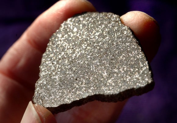 Did this slice of meteorite come from Hebe? I'm holding a small slice of NWA 2710, an H5 chondrite. Credit: Bob King