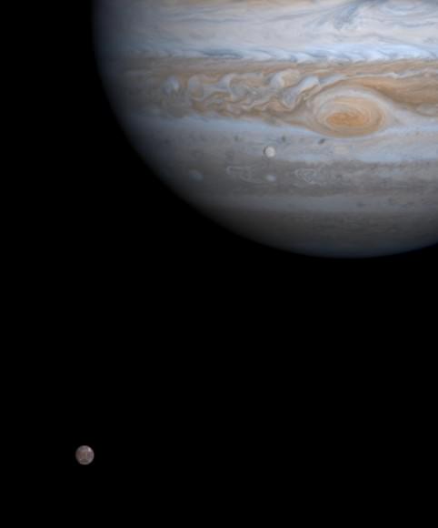 Europa (bottom left) in orbit around its planet, Jupiter, as spotted from the Cassini spacecraft in 2000. Credit: NASA/JPL/University of Arizona