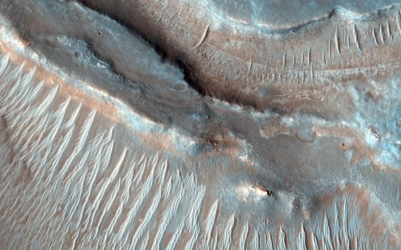 These transverse aeolian ridges seen by the Mars Reconnaissance Orbiter are caused by wind, but scientists are unsure why this image (released in December 2014) shows two wavelengths of ripples. Credit: NASA/JPL-Caltech/University of Arizona
