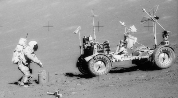 Apollo 17 commander Gene Cernan with a gravimeter experiment. The lunar rover is at right. Credit; NASA