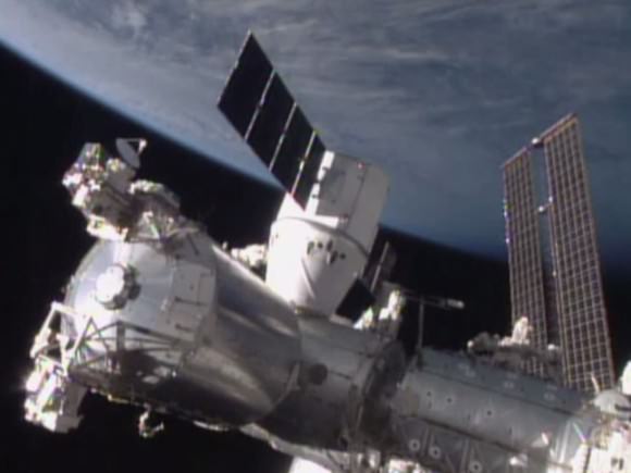 The SpaceX Dragon is attached to the Harmony module. Credit: NASA TV