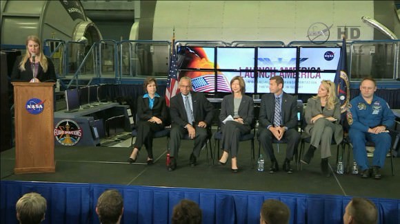 NASA's Stephanie Schierholz introduces the panel of Johnson Space Center Director Dr. Ellen Ochoa, seated, left, NASA Administrator Charles Bolden, Commercial Crew Program Manager Kathy Lueders, Boeing's John Elbon, SpaceX's Gwynne Shotwell and NASA astronaut Mike Fincke.  Credit:  NASA TV