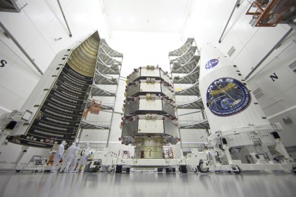 NASA's Magnetospheric Multiscale (MMS) observatories are shown here in the clean room being processed for a March 12, 2015 launch from Space Launch Complex 41 on Cape Canaveral Air Force Station, Florida.  Credit: NASA/Ben Smegelsky