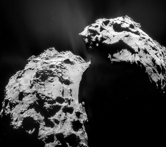 Four-image mosaic shows the overall view of the comet on January 22 photographed 17.4 miles (28 km) from its center. The larger of the two lobes is at left; Hapi is the smooth region at the transition between the lobes. Credit: ESA/Rosetta/Navcam