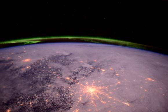 #Moscow shining like a bright star under the aurora.    Credit: NASA/Terry Virts   