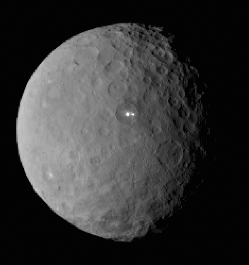 This image was taken by NASA's Dawn spacecraft of dwarf planet Ceres on Feb. 19 from a distance of nearly 29,000 miles (46,000 km). It shows that the brightest spot on Ceres has a dimmer companion, which apparently lies in the same basin. See below for the wide view. Credit: NASA/JPL-Caltech/UCLA/MPS/DLR/IDA