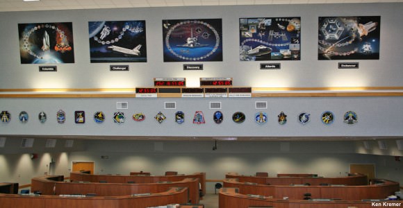 Memorial displays to all five Space Shuttle Orbiters mounted inside the Space Shuttle Firing Room #4 - above the Shuttle countdown clock. These tribute displays highlight and honor the significant achievements from the actual space voyages of the individual Orbiters launched from the Kennedy Space Center over three decades –starting with STS-1 in 1981. Shuttle mission patches since the return to flight in 2005 are mounted below the tribute displays. Click to enlarge. Credit: Ken Kremer/kenkremer.com.