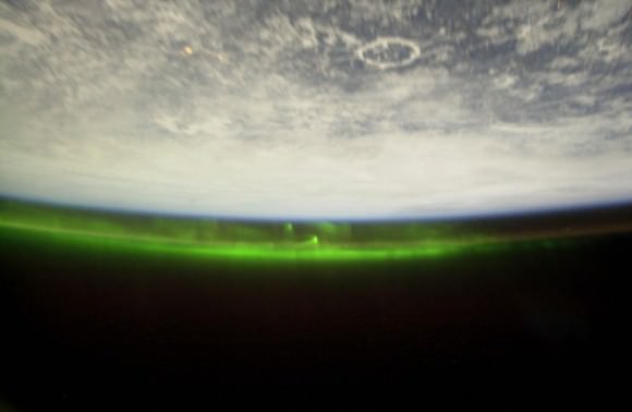 Auroras photographed from The International Space Station. The distinct Manicouagan impact crater is seen in northern Canada. Terrestial aurora exist at altitudes of 100 km (60 miles) (Credit: NASA)