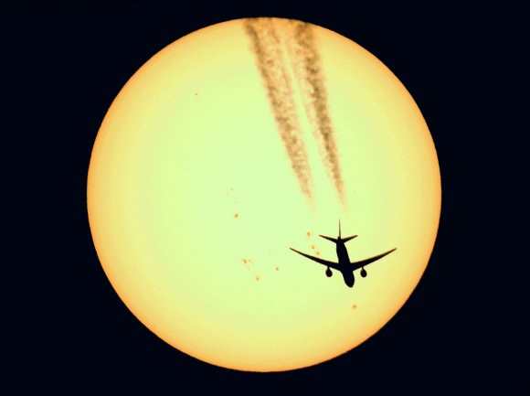 A Boeing 777 and a sunspot crosses the Sun on April 17, 2014, as seen from France. Credit and copyright: Sebastien Lebrigand.