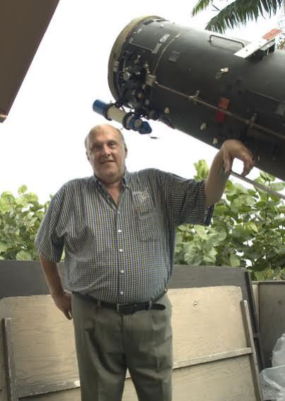 Don Parker with his 16-inch telescope, which he used to take thousands of superb images of the planets. Photo by Sean Walker.
