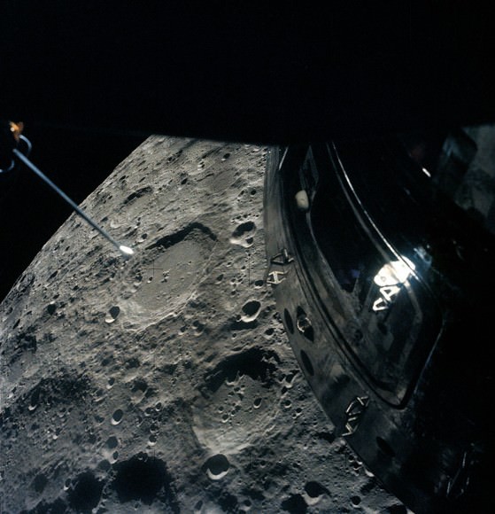 Apollo 13's view  from Aquarius as it rounds the Moon, with the Command Module at right. Credit: NASA/Johnson Space Center. 