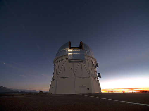The silvered dome of the Blanco 4-meter telescope holds the DECam at the Cerro Tololo Inter-American Observatory in Chile. (Photo credit: T. Abbott and NOAO/AURA/NSF)