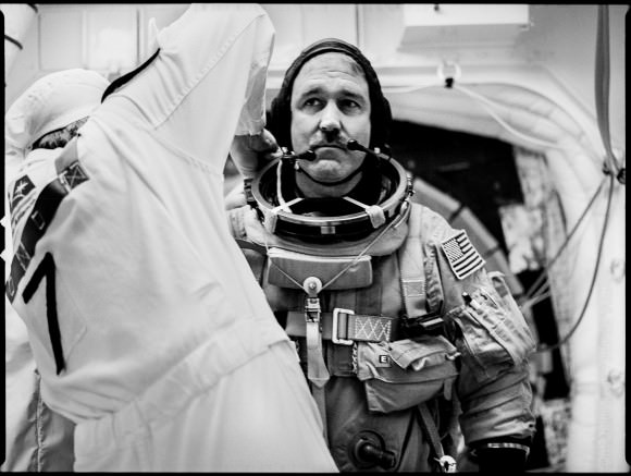 John Grunsfeld, just before entering shuttle Atlantis for his fifth mission in space and his third to the Hubble Space Telescope. Grunsfeld wrote "Climbing Mountains" for Infinite Worlds. Credit and copyright: Michael Soluri.