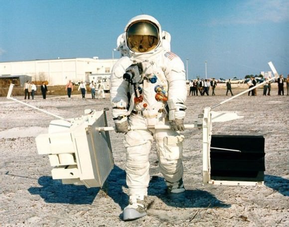 Apollo 13 Commander Jim Lovell carrying a plutonium battery and scientific equipment during training. Credit: NASA.