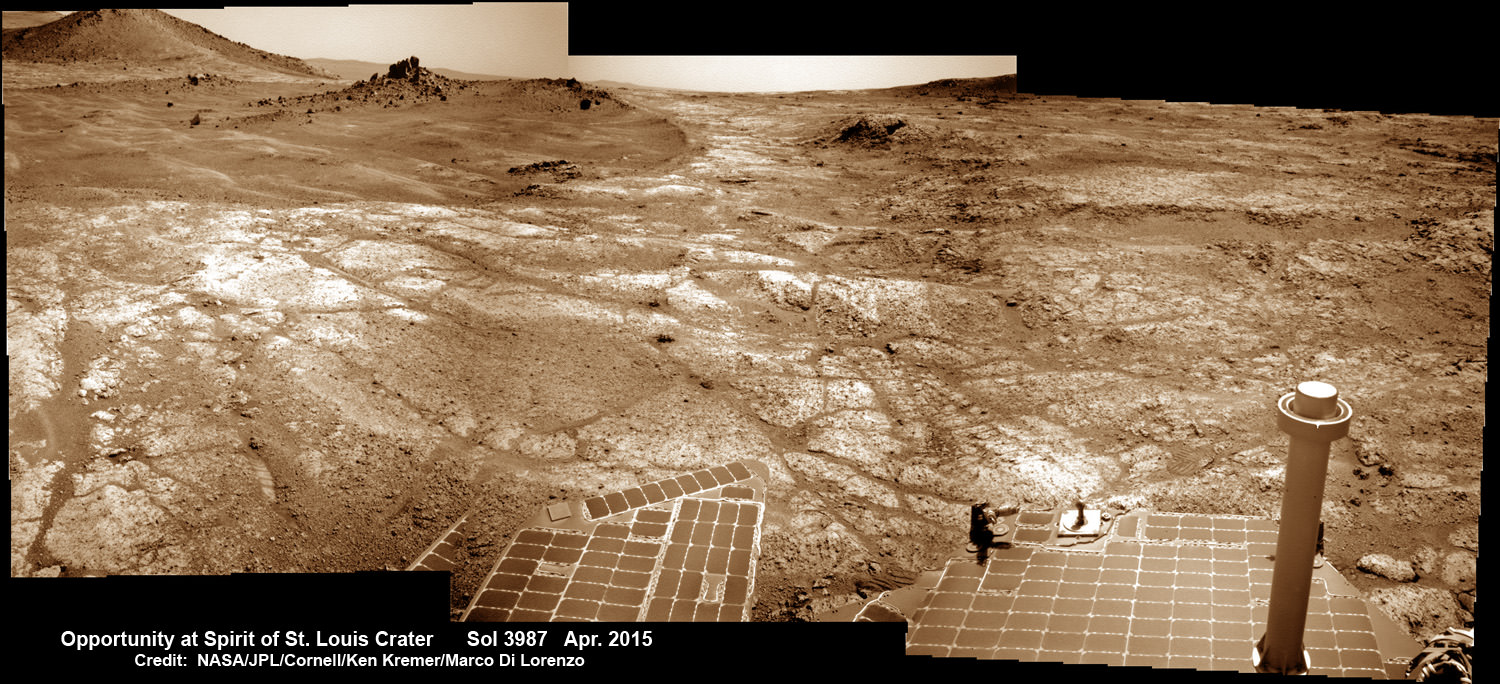 Opportunity at Spirit of Saint Louis crater scanning into Marathon Valley and Endeavour crater from current location on Mars in April 2015 in this photo mosaic.  The crater, featuring an odd mound of rocks now named Lingbergh Mound, is the gateway to Marathon Valley and exposures of water altered clay minerals.  This navcam camera photo mosaic was assembled from images taken on Sol 3987 (April 12, 2015) and colorized.  Credit: NASA/JPL/Cornell/ Ken Kremer/kenkremer.com/Marco Di Lorenzo