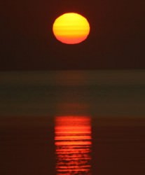 Sunrise of Lake Superior. Atmospheric refraction - bending of the Sun's light - flattens the disk into an oval shape. Credit: Lyle Anderson