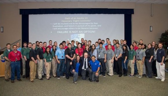 Jerry Woodfill with students from the Community College Aerospace Scholars, with the 'Failure Is Not an Option' pledge in the background. Image courtesy Jerry Woodfill. 