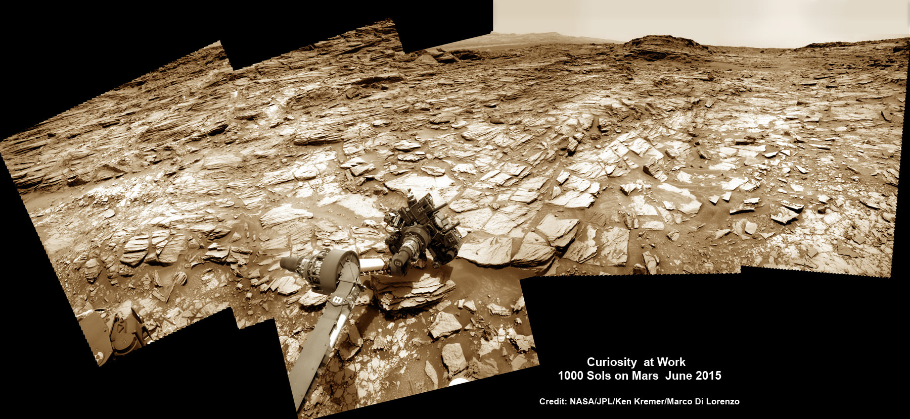 Curiosity rover at work for 1000 Sols on Mars.  This composite multi sol photo mosaic shows outstretched robotic arm inspecting intriguing rock outcrops.   The APXS spectrometer is investigating a target called ‘Ronan’ on the Stimson overlying outcrop.   Navcam camera raw images taken from sols 997 to 1000 are stitched and colorized.  Credit: NASA/JPL/Ken Kremer/kenkremer.com/Marco Di Lorenzo   