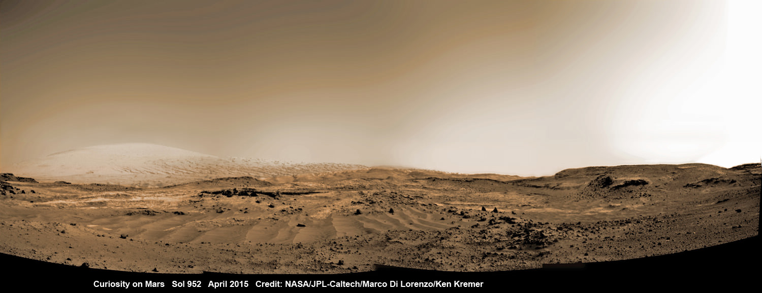 Curiosity rover rolls across Mars at the foothills of Mount Sharp, seen in the background, in this mosaic of images taken on April 11, 2015 (Sol 952).  Navcam camera raw images stitched and colorized. Credit:  NASA/JPL-Caltech/ Marco Di Lorenzo/Ken Kremer/kenkremer.com 