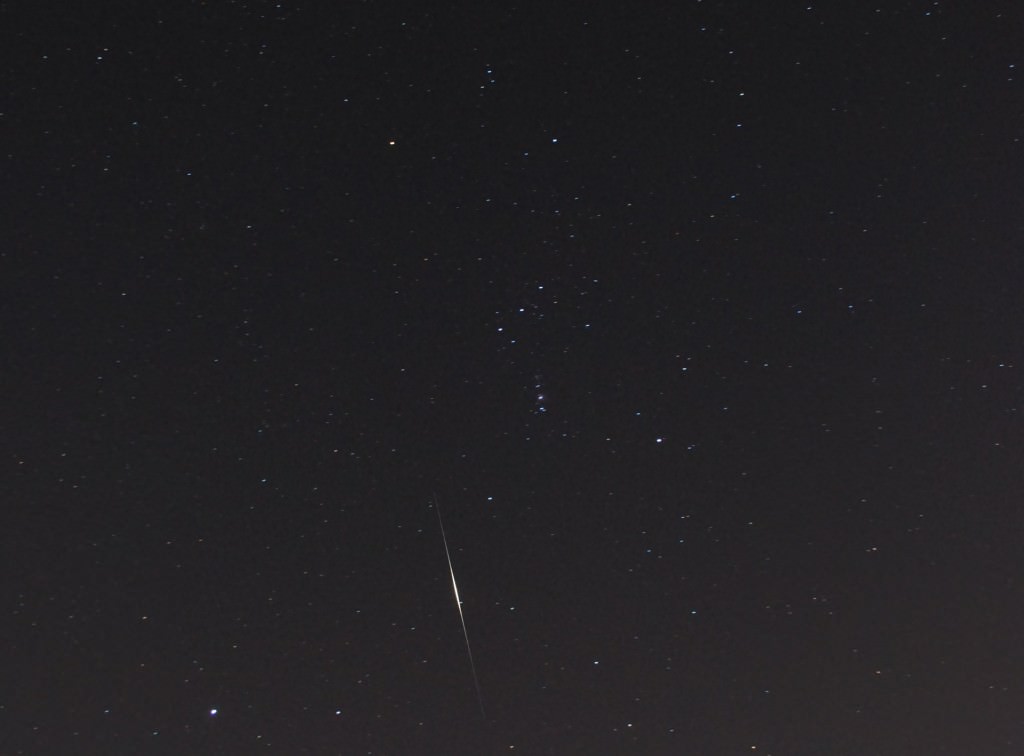 An Iridium flare through the constellations Orion and Lepus. Image credit: David Dickinson