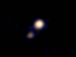 Pluto (upper right) and its largest moon Charon form a "double planet" as seen in this photo taken by NASA's New Horizons probe which is set to make a close flyby of the Pluto system on July 14. Credit: NASA / NASA / Johns Hopkins University Applied Physics Laboratory / Southwest Research Institute