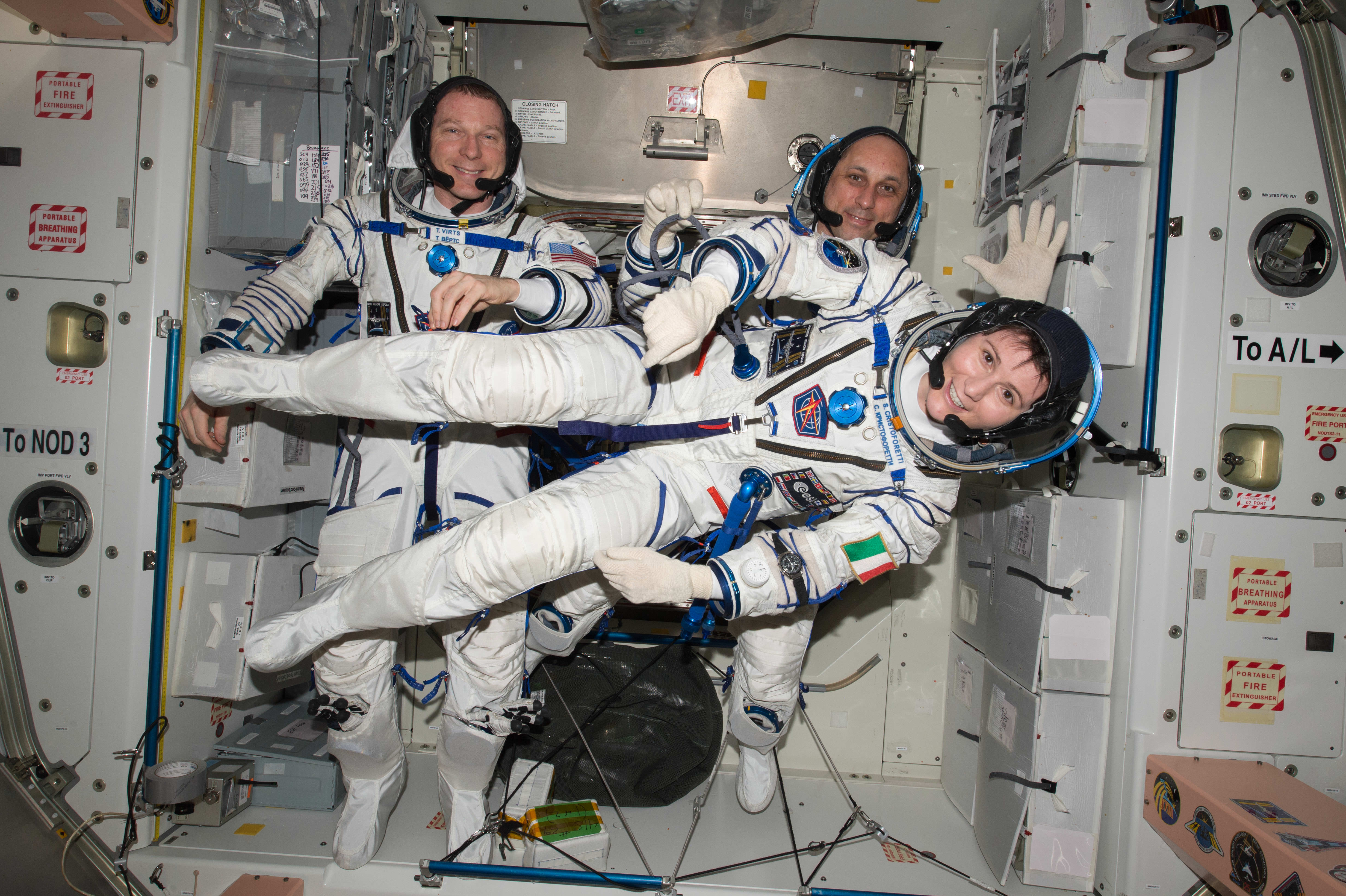 NASA astronaut Terry Virts (left) Commander of Expedition 43 on the International Space Station along with crewmates Russian cosmonaut Anton Shkaplerov (center) and ESA (European Space Agency) astronaut Samantha Cristoforetti on May 6, 2015 perform a checkout of their Russian Soyuz spacesuits in preparation for the journey back to Earth - now set for June 11, 2015.  Credits: NASA