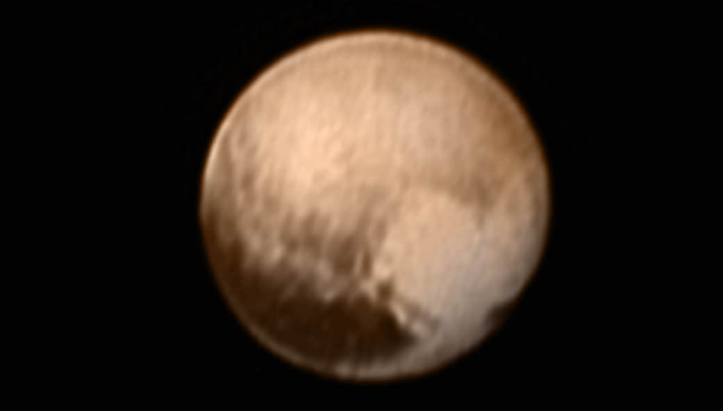 Pluto’s “Heart” is seen in this new image from New Horizons’ Long Range Reconnaissance Imager (LORRI) received on July 8, 2015 after normal science operations resumed following the scary July 4 safe mode anomaly that briefing shut down all science operations.   The LORRI image has been combined with lower-resolution color information from the Ralph instrument.   Credits: NASA-JHUAPL-SWRI 