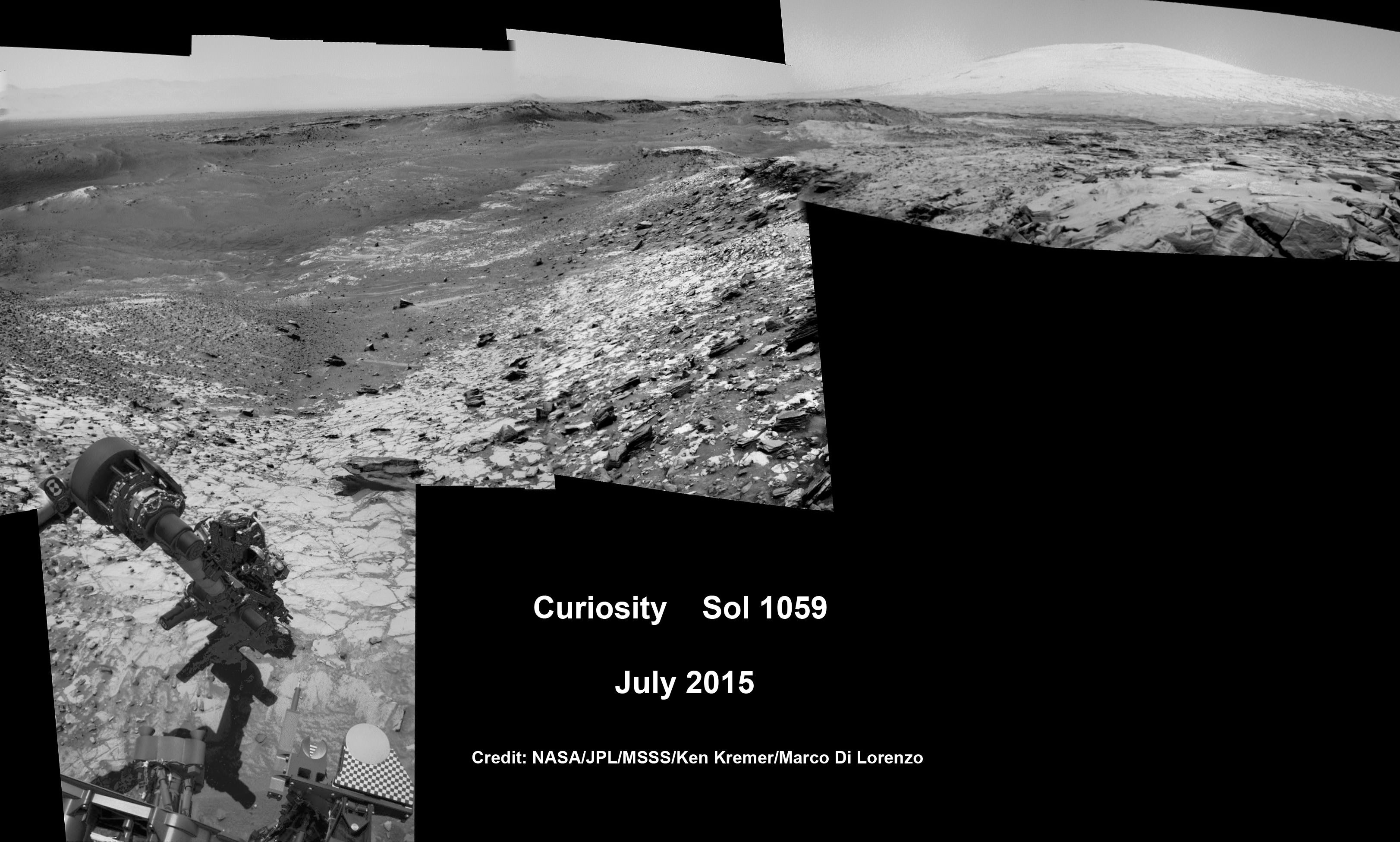 Curiosity conducts test drill at “Buckskin” rock target at bright toned “Lion” outcrop on the lower region of Mount Sharp on Mars, seen at right.   Gale crater rim seen in the distant background at left, in this composite mosaic of navcam raw images taken to Sol 1059, July 30, 2015.  Navcam camera raw images stitched. Credit:  NASA/JPL-Caltech/Ken Kremer/kenkremer.com/Marco Di Lorenzo  