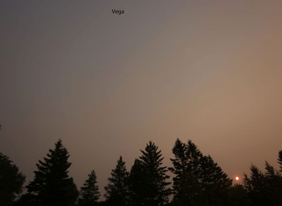 The Moon sits at lower right with the star Vega visible at the top of the frame in this 30-second time exposure made last night (July 2) under the pall of forest fire smoke. Credit: Bob King