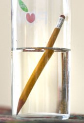 Light rays get bent or refracted when they move from one medium to another. We've all seen the "broken pencil" effect when light travels from air into water.