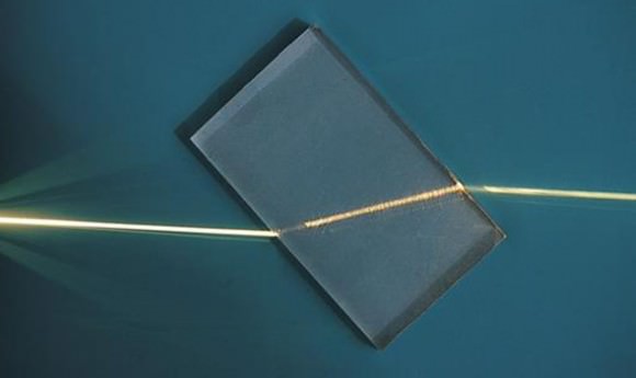 A ray of light refracted by a plastic block. Notice that the light bends twice - once when it enters (moving from air to plastic) and again when it exits (plastic to air). 