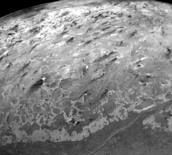 Dark streaks on Triton formed by deposits from ice or cryovolcanos. Credit: NASA