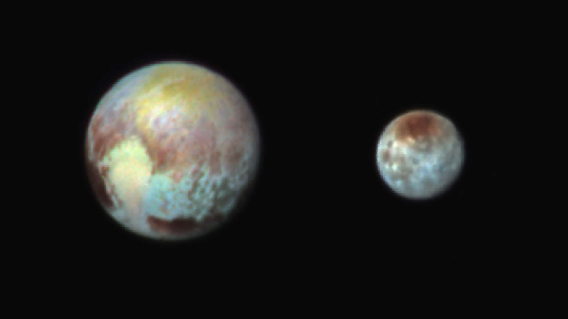 Pluto and Charon in False Color Show Compositional Diversity. This July 13, 2015, image of Pluto and Charon is presented in false colors to make differences in surface material and features easy to see. It was obtained by the Ralph instrument on NASA's New Horizons spacecraft, using three filters to obtain color information, which is exaggerated in the image.  These are not the actual colors of Pluto and Charon, and the apparent distance between the two bodies has been reduced for this side-by-side view.   Credit: NASA/APL/SwRI