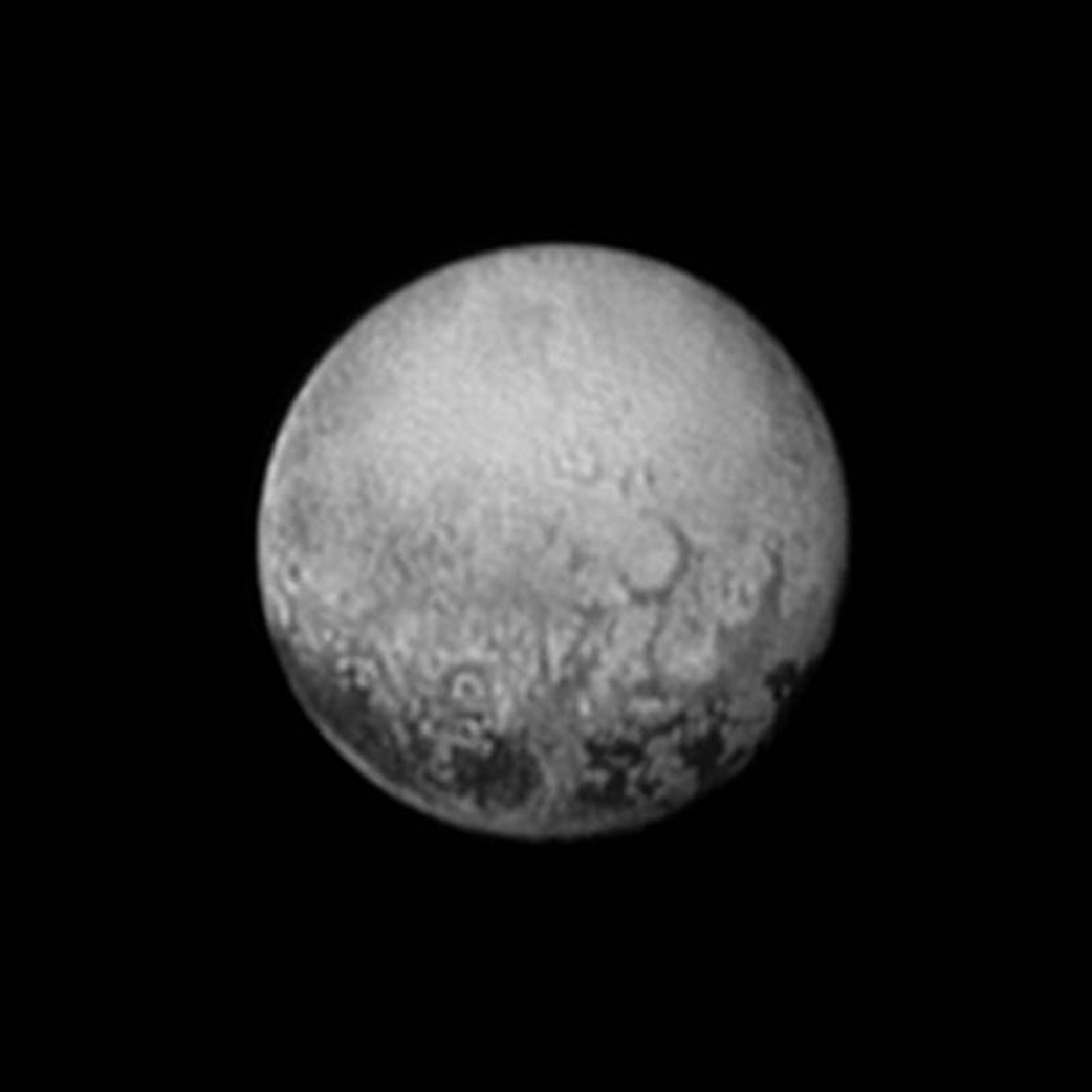 New Horizons' last look at Pluto's Charon-facing hemisphere reveals the highest resolution view of four intriguing darks spots for decades to come.  This image, taken early the morning of July 11, 2015, shows newly-resolved linear features above the equatorial region that intersect, suggestive of polygonal shapes. This image was captured when the spacecraft was 2.5 million miles (4 million kilometers) from Pluto.  Credit: NASA/JHUAPL/SWRI