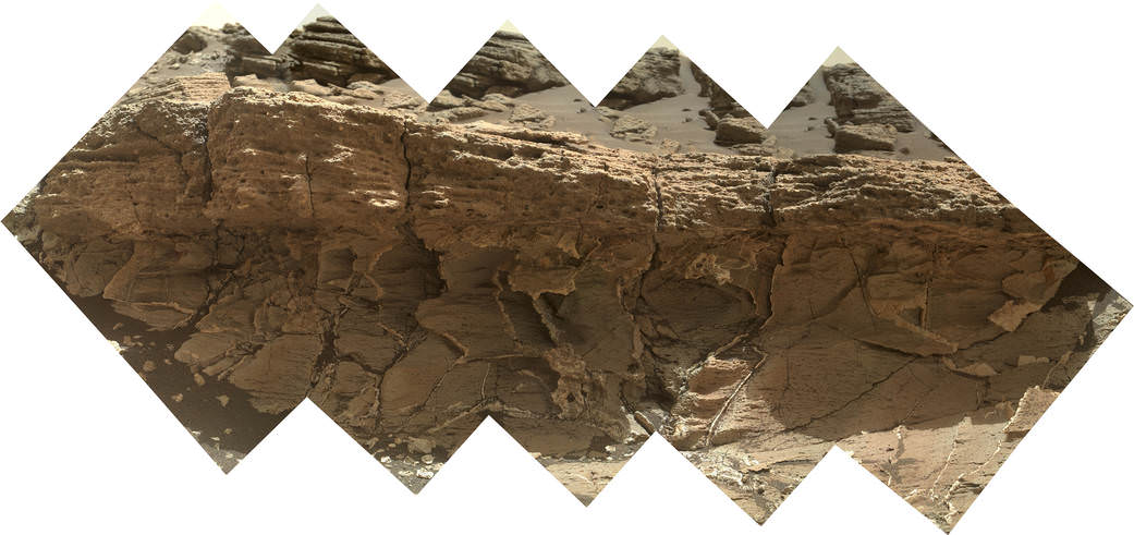 A rock outcrop dubbed "Missoula," near Marias Pass on Mars, is seen in this image mosaic taken by the Mars Hand Lens Imager on NASA's Curiosity rover. Pale mudstone (bottom of outcrop) meets coarser sandstone (top) in this geological contact zone, which has piqued the interest of Mars scientists.   Credit: NASA/JPL-Caltech/MSSS