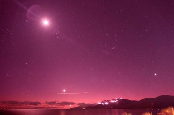 Sirius (to the lower right) along with The Moon, Venus and Mercury and a forest fire taken on July 22, 2014. (Note- this was shot from the Coral Towers Observatory in the southern hemisphere). Image credit and copyright: Joseph Brimacombe  