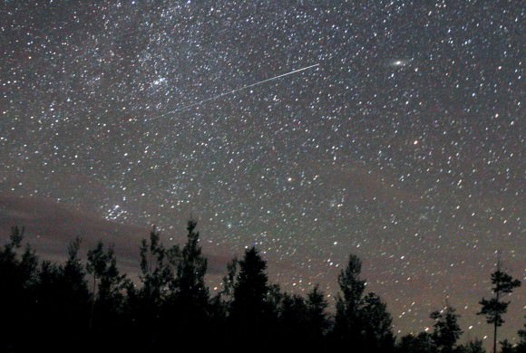 A Perseid meteor streaks across the northeastern sky two Augusts ago. This year's shower will peak on the night of August 12-13 with up to 100 meteors per hour visible from a dark sky. Credit: Bob King