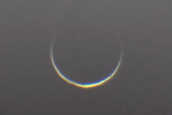 Venus at inferior conjunction on January 10, 2014 shows both the sunlit crescent and cusp extensions from sunlight penetrating the atmosphere from behind. Credit: Tudorica Alexandru
