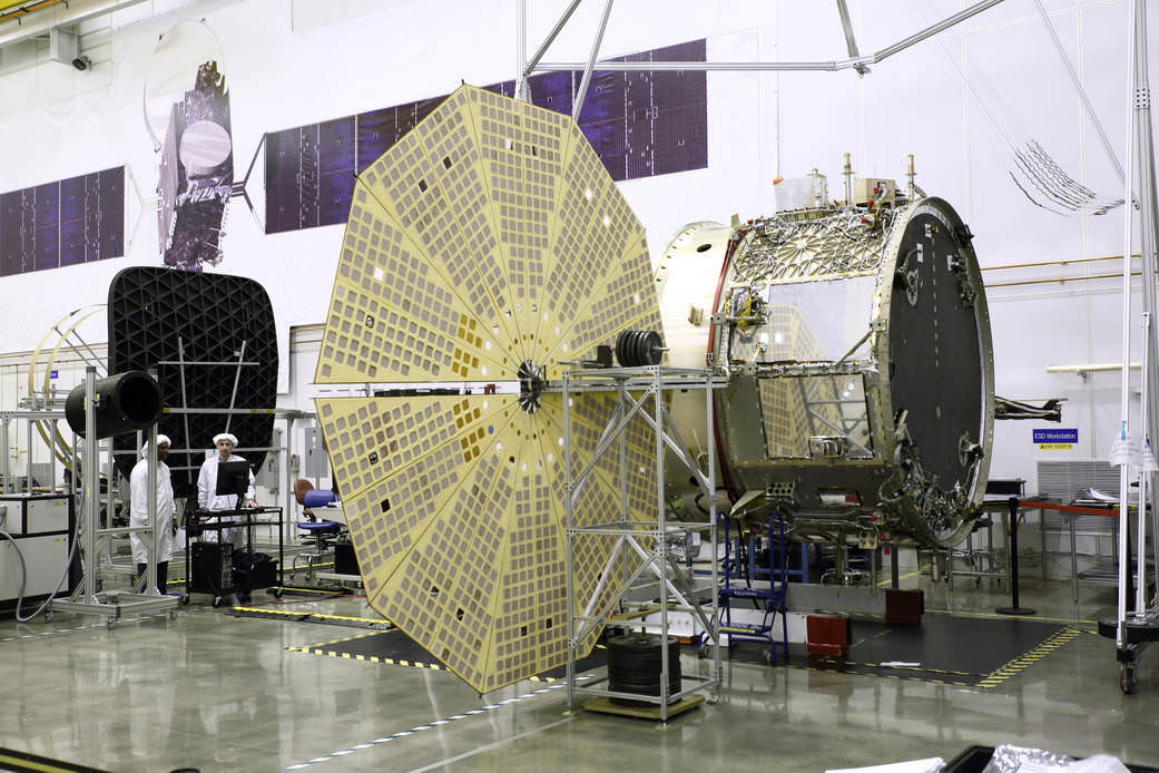 The OA-4 Service Module (SM) undergoing deployment testing of one of its two UltraflexTM solar arrays at orbital ATK’s Dulles, Virginia satellite manufacturing facility. Orbital ATK’s Space Components Division supplies the Ultraflex arrays.  Credit: Orbital ATK