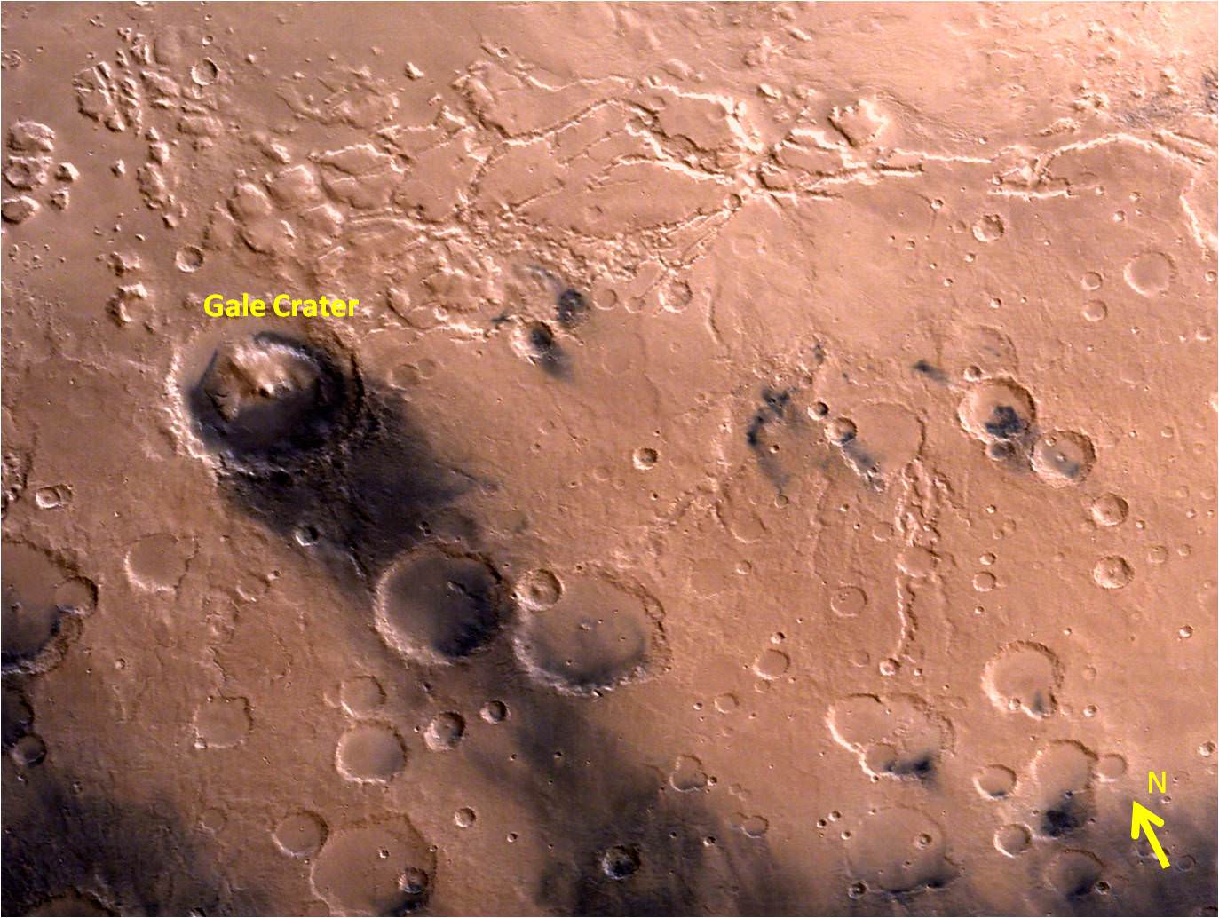 Gale Crater - landing site of NASA’s Curiosity rover - and vicinity as seen by India’s Mars Orbiter Mission from an altitude of 9004 km.  Gale crater is home to humongous Mount Sharp which rises 5.5 km from the crater floor and is easily visible in this photo.   Credit: ISRO
