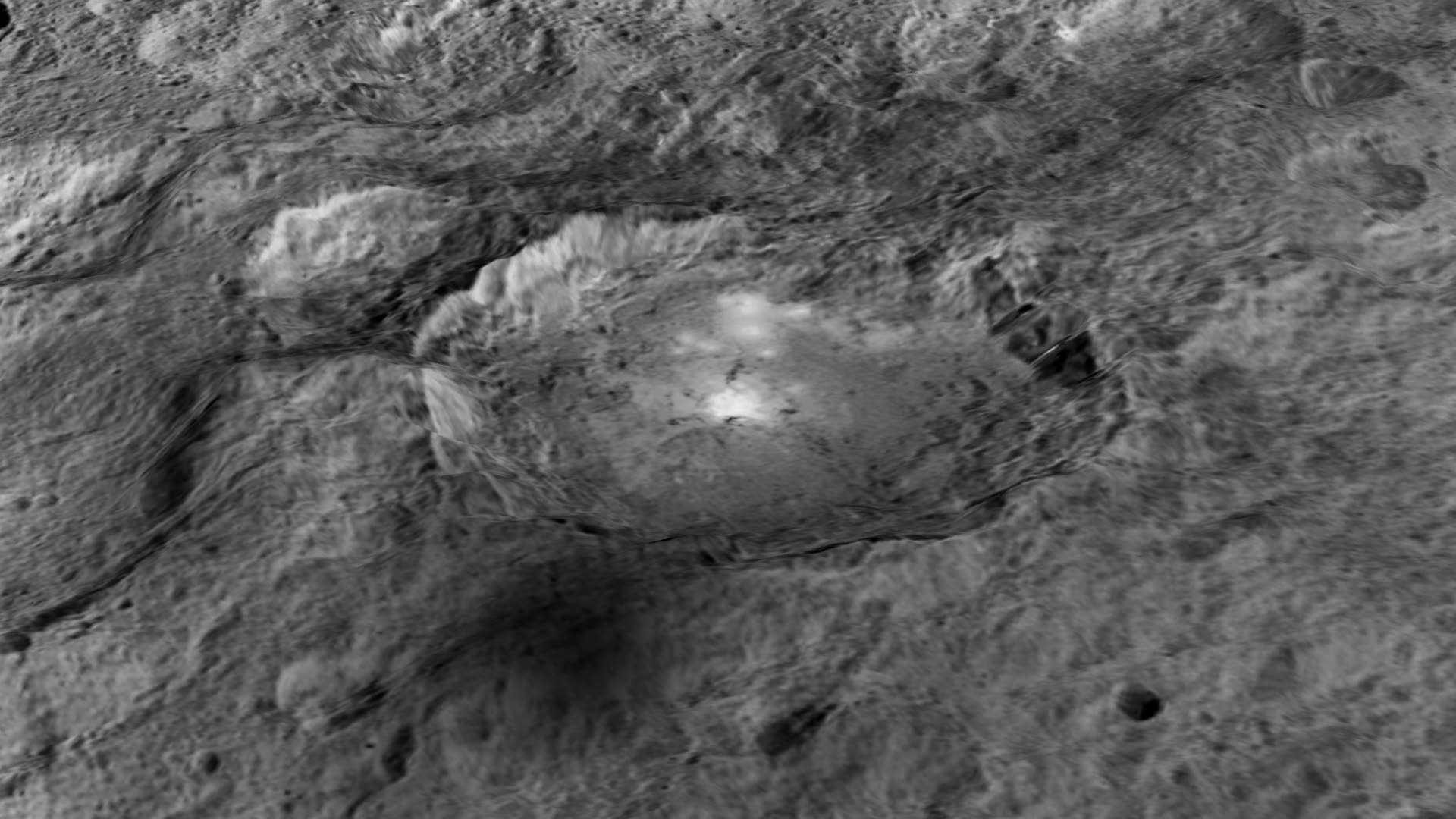 The intriguing brightest spots on Ceres lie in a crater named Occator, which is about 60 miles (90 kilometers) across and 2 miles (4 kilometers) deep.  Vertical relief has been exaggerated by a factor of five. Exaggerating the relief helps scientists understand and visualize the topography much more easily, and highlights features that are sometimes subtle.  Credits: NASA/JPL-Caltech/UCLA/MPS/DLR/IDA/LPI