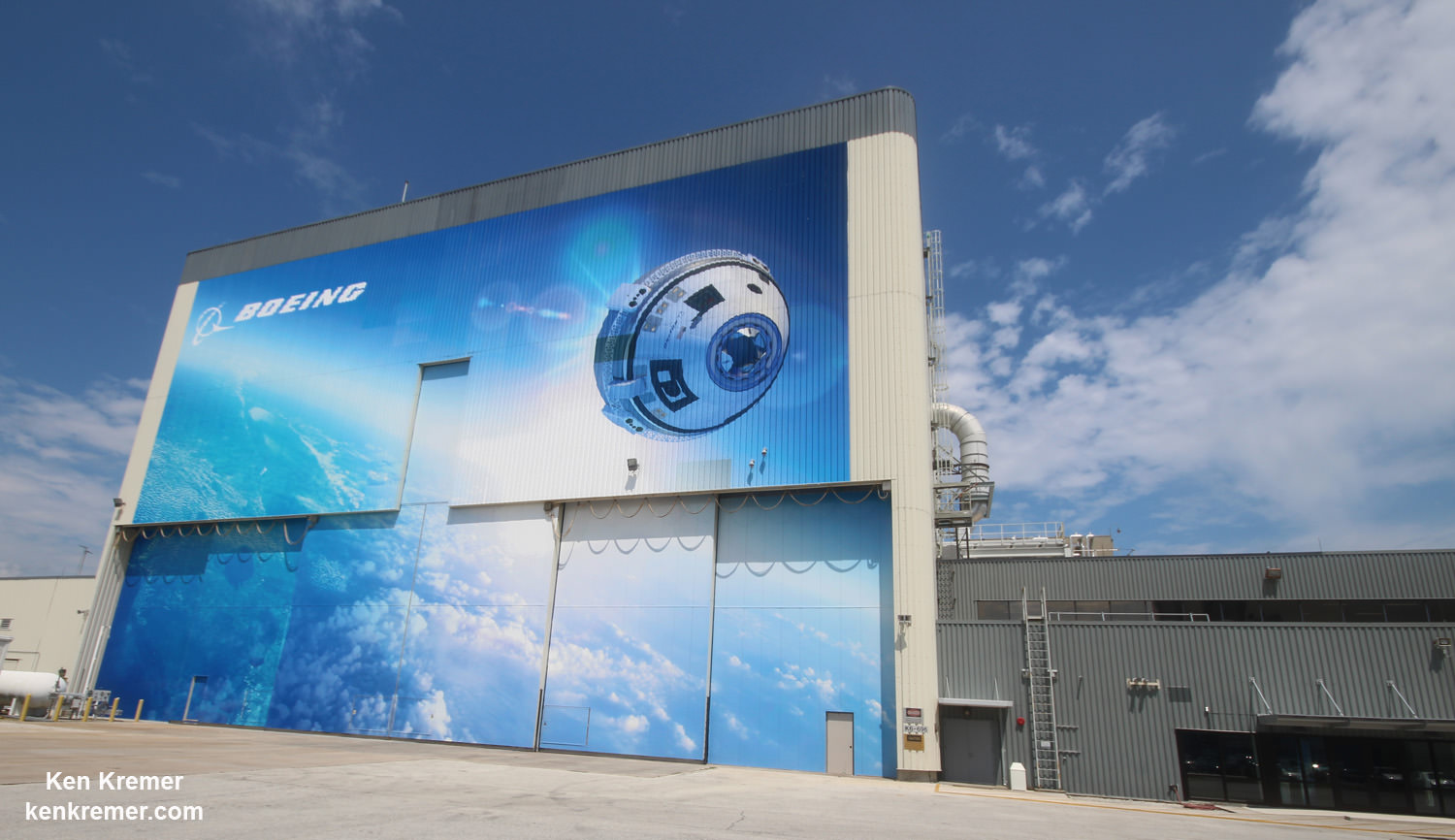 Boeing ‘Starliner’ commercial crew space taxi manufacturing facility marks Grand Opening at the Kennedy Space Center on Sept 4. 2015.   Exterior view depicting newly installed mural for the Boeing Company’s newly named CST-100 ‘Starliner’ commercial crew transportation spacecraft on the company’s Commercial Crew and Cargo Processing Facility (C3PF) at NASA’s Kennedy Space Center in Florida.  Credit: Ken Kremer /kenkremer.com
