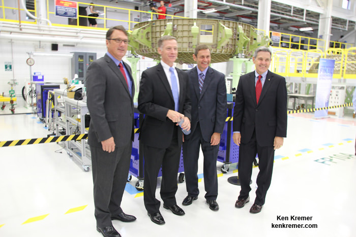 Boeing and NASA managers pose with the Boeing CST-100 Starliner crew module  being assembled into the Structural Test Article at company’s C3PF facility at the Kennedy Space Center in Florida.  From left are John Mulholland, Boeing Vice President Commercial Programs;  Chris Ferguson, former shuttle commander now Boeing deputy manager Commercial Crew Program; John Elbon, Boeing vice president and general manager of Space Exploration; and Robert Cabana, former shuttle commander and now Director NASA’s Kennedy Space Center, on Sept. 4, 2015. 