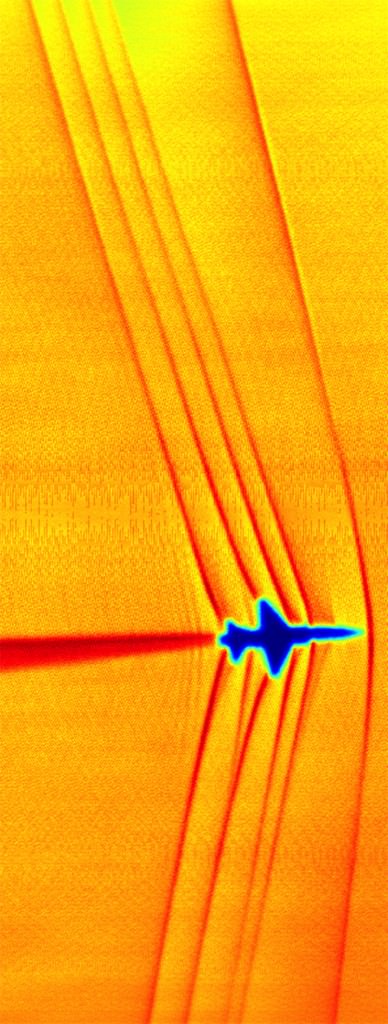This schlieren image of shock waves created by a T-38C in supersonic flight was captured using the sun’s edge as a light source and then processed using NASA-developed code. Credit: NASA.