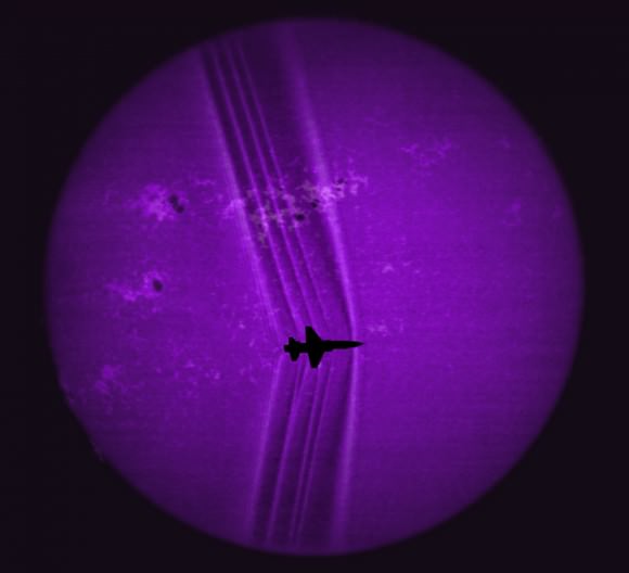Using the solar disk as a backdrop, its details revealed by a calcium-K optical filter, researchers processed this image to reveal shock waves created by a supersonic T-38C. Credit: NASA. 