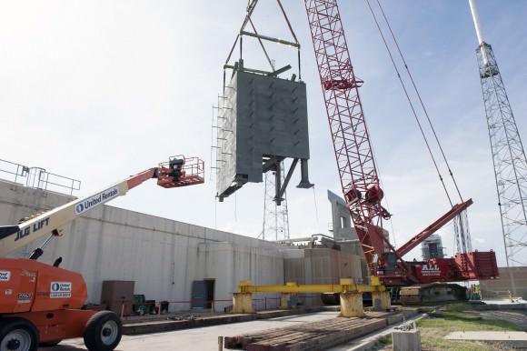 The first tier of the new Crew Access Tower for the Boeing CST-100 Starliner is installed at Space Launch Complex-41 at Cape Canaveral Air Force Station in Florida on Sept 9, 2015 where United Launch Alliance  Atlas V rockets will lift Boeing Starliners into orbit.  Photo credit: NASA/Dmitrios Gerondidakis