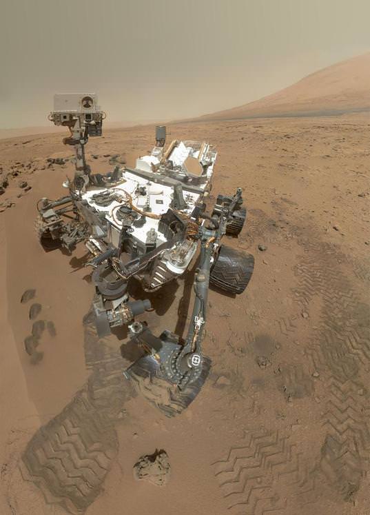 A color self-portrait photo of Curiosity standing on Mars, on sol 84 (October 31, 2012). The photo is a mosaic of images shot with MAHLI, the camera on the end of the robotic arm. Credit: NASA/JPL/MSSS.