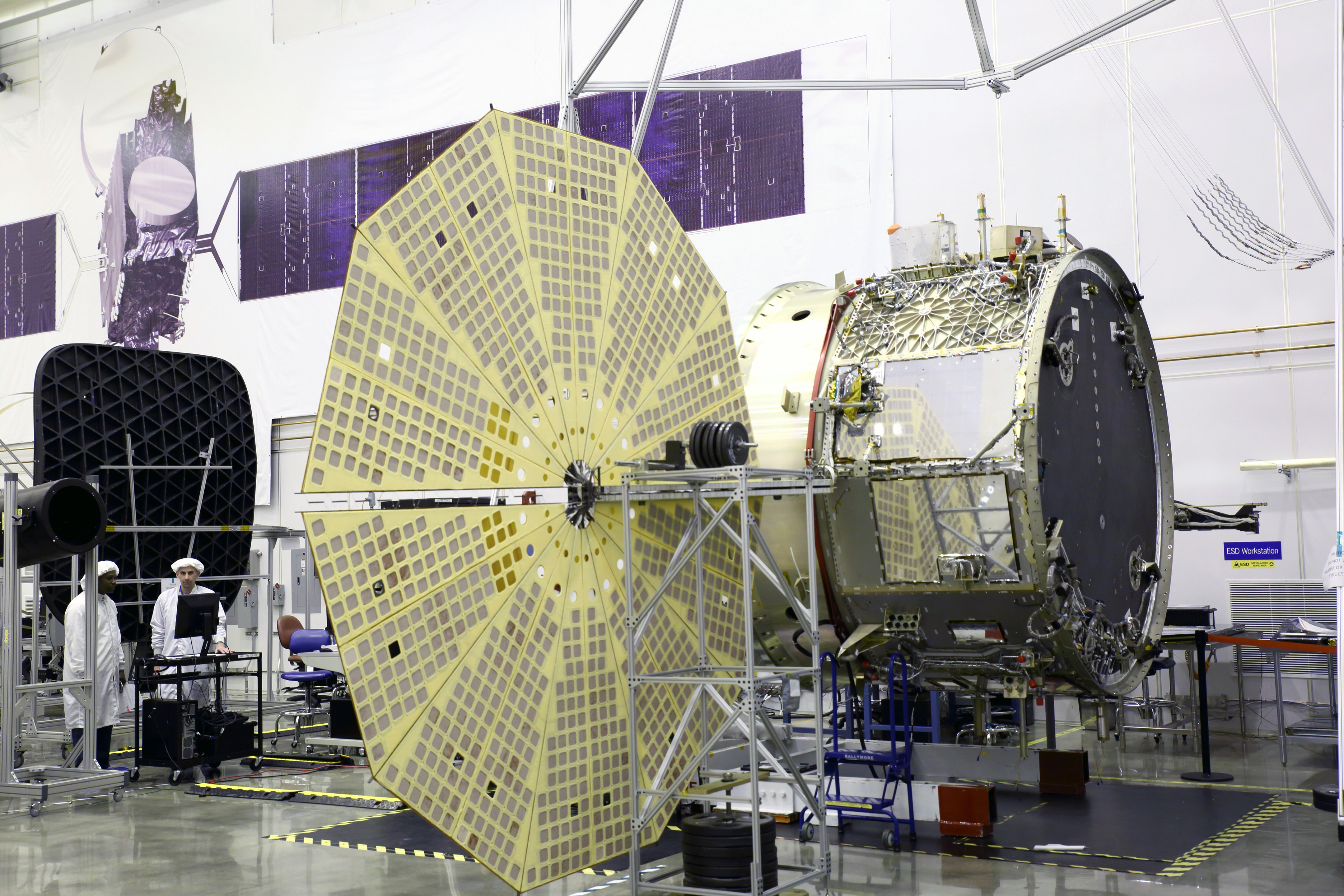 Cygnus service module built by Orbital ATK in their Dulles, Virginia cleanroom is shown here with unfurled Ultraflex solar panels that will fly for the first time with mated pressurized module on the OA-4 ISS resupply mission on ULA Atlas V rocket on Dec. 3, 2015 from Cape Canaveral, Florida.    Credit: Orbital ATK