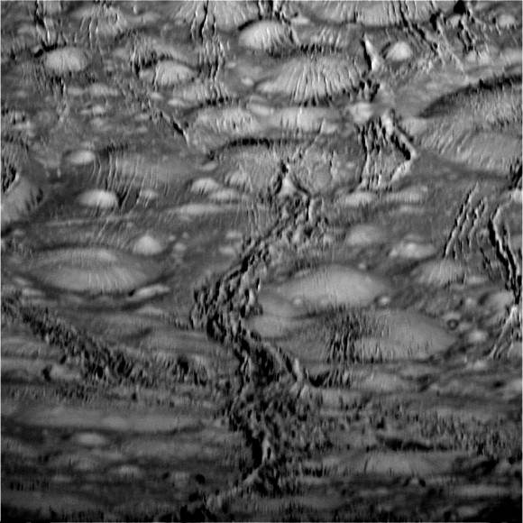 A complex region of craters and fractures near the north polar region on Saturn's  moon Enceladus. Image from Cassini spacecraft taken on October 14, 2015. Credit: NASA/JPL-Caltech/Space Science Institute 